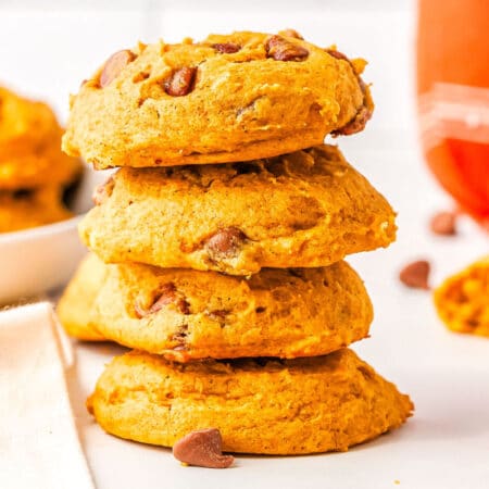 a stack of pumpkin chocolate chip cookies