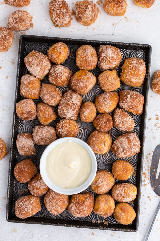 An overhead picture of copycat cinnamon sugar pretzel bites on a baking sheet.