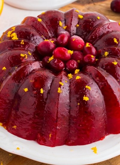 A close up picture of the finished Cranberry Jello Salad on a white serving plate.