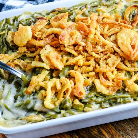 A serving spoon resting in the casserole.