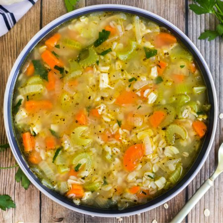 An overhead picture of turkey barley soup in a bowl.