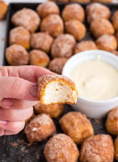 A bite taken out of a cinnamon sugar pretzel bite.