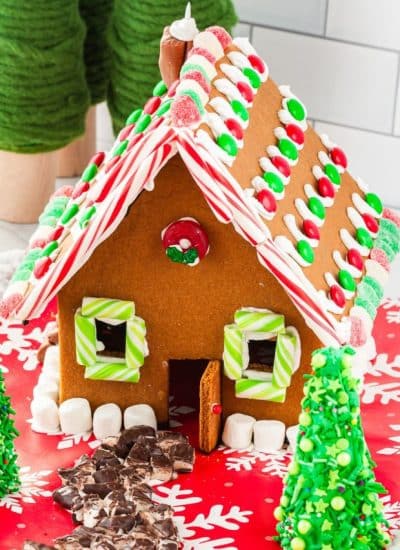 The finished gingerbread house recipe that has been decorated.