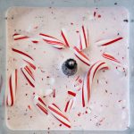 A close up picture of the peppermint milkshake with candy cane pieces on top.