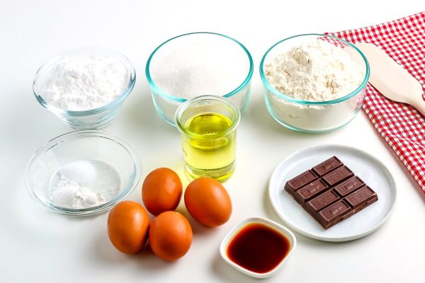 All of the ingredients needed to make chocolate crinkle cookies.
