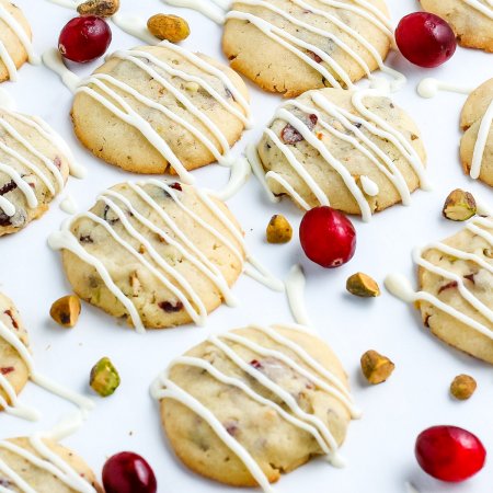 A close up picture of the finished Cranberry Cookies on a white surface.