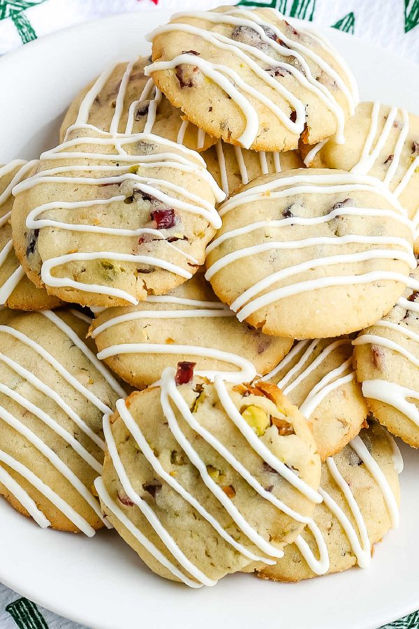 An overhead picture of cranberry pistachio cookies on a white plate. 