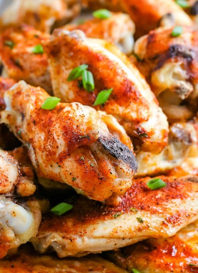 A close up picture of a pile of Baked Chicken Wings.