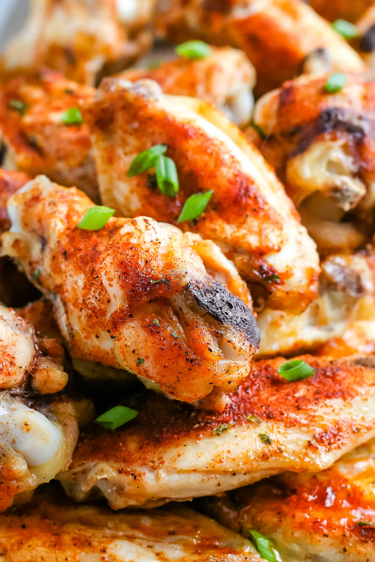 A close up picture of a pile of Baked Chicken Wings.