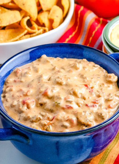 A close up of the finished Chile Con Queso in a blue bowl.