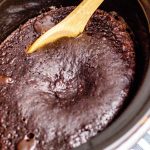 The finished Crockpot Chocolate Lava Cake with a serving spoon in it.
