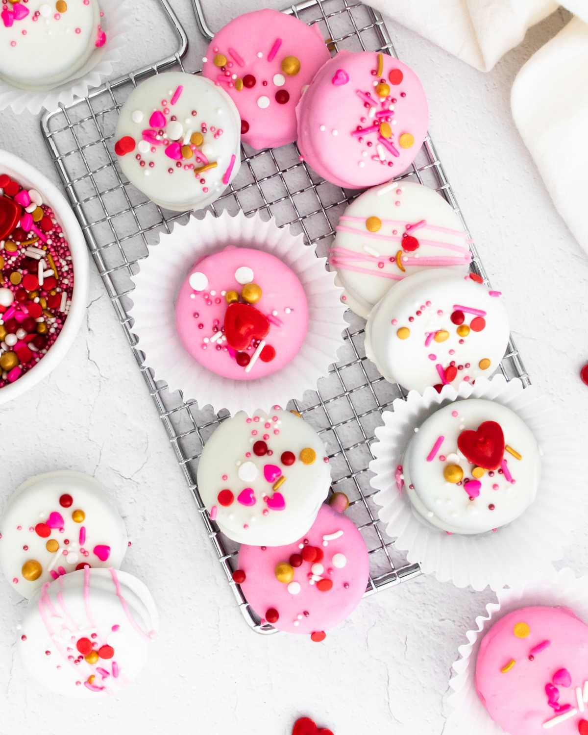 An overhead picture of White Chocolate Dipped Oreos and some sprinkles.