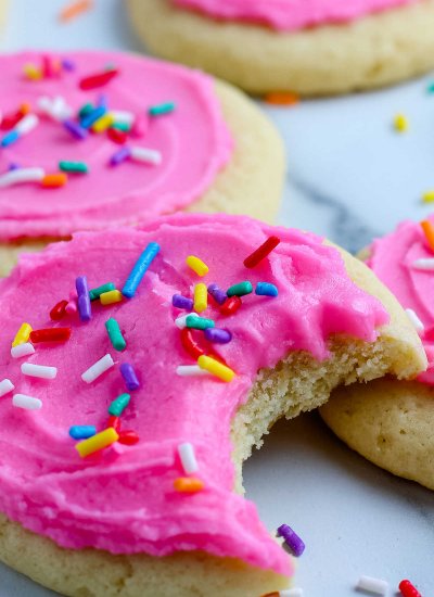 A close up picture of a Lofthouse Sugar Cookie with a bite taken out of it.
