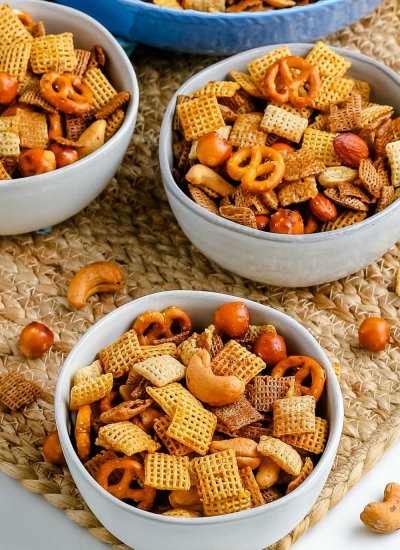 Chex Party Mix in three white bowls.