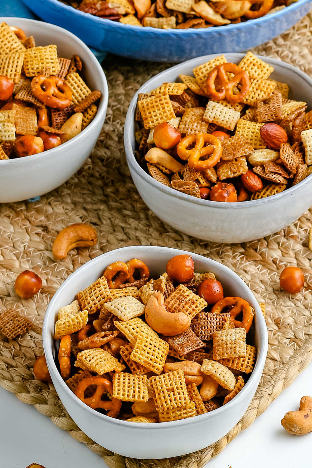 Chex Party Mix in three white bowls.