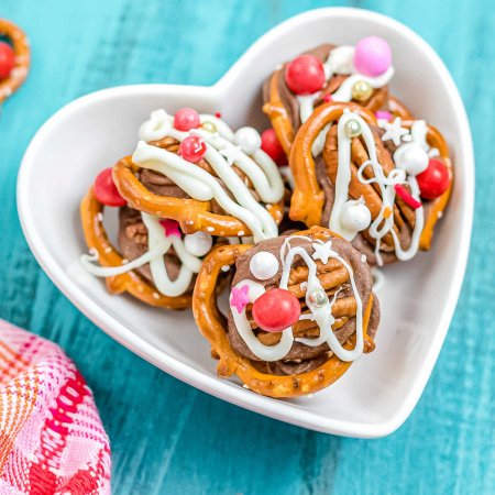 Rolo Pretzel Turtles in a heart-shaped candy dish.