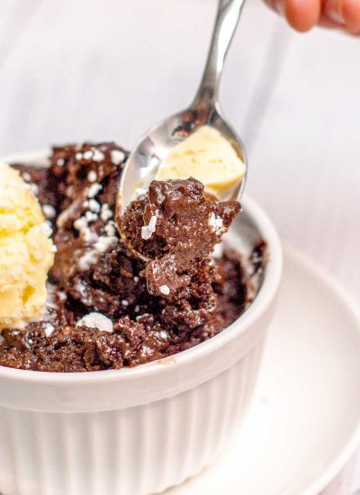 lava cake in a bowl with a scoop of vanilla ice cream.