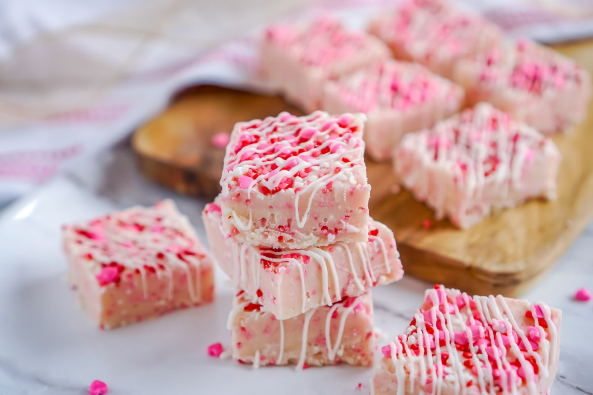 The finished Easy Valentine's Day Fudge Recipe sliced and 3 pieces stacked on top of each other.