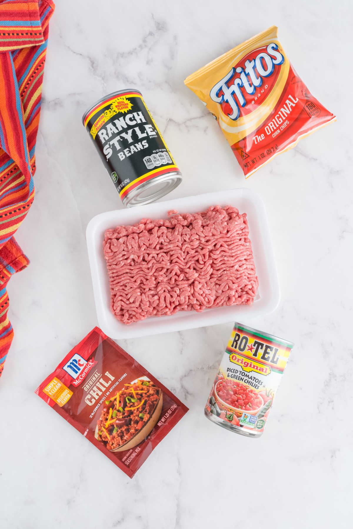 An overhead picture of all of the ingredients needed to make Walking Tacos.