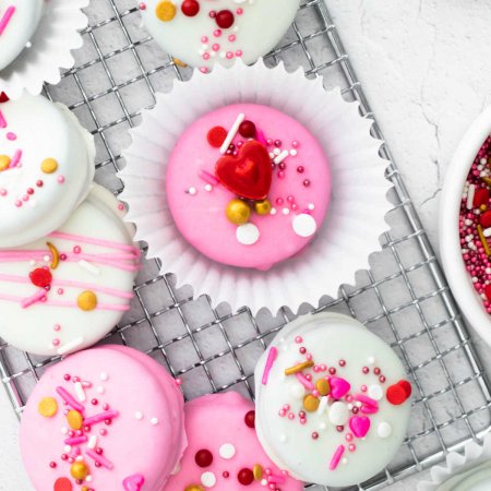 A close up picture of White Chocolate Dipped Oreos decorated for Valentine's Day.