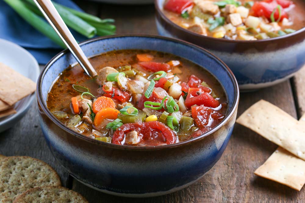 The finished Chicken Vegetable Soup recipe in a blue bowl.