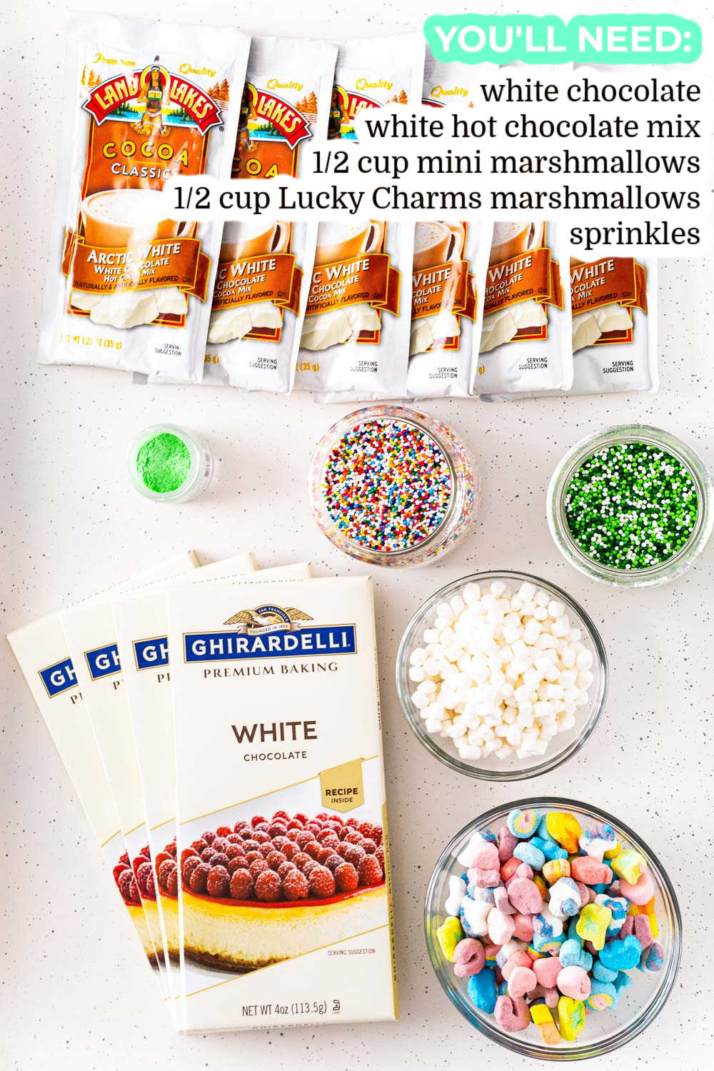 All of the ingredients needed to make Rainbow White Hot Chocolate Bombs.