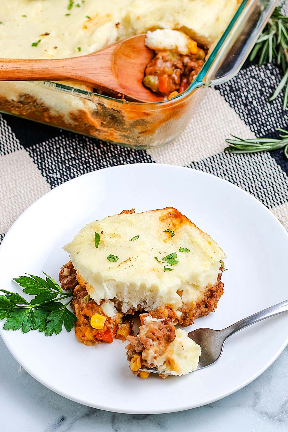 An overhead picture of Shepherd's Pie on a plate and in a casserole dish.