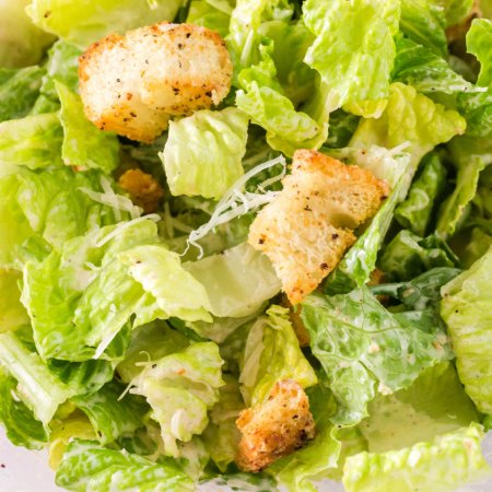 Caesar Salad in a clear glass bowl.
