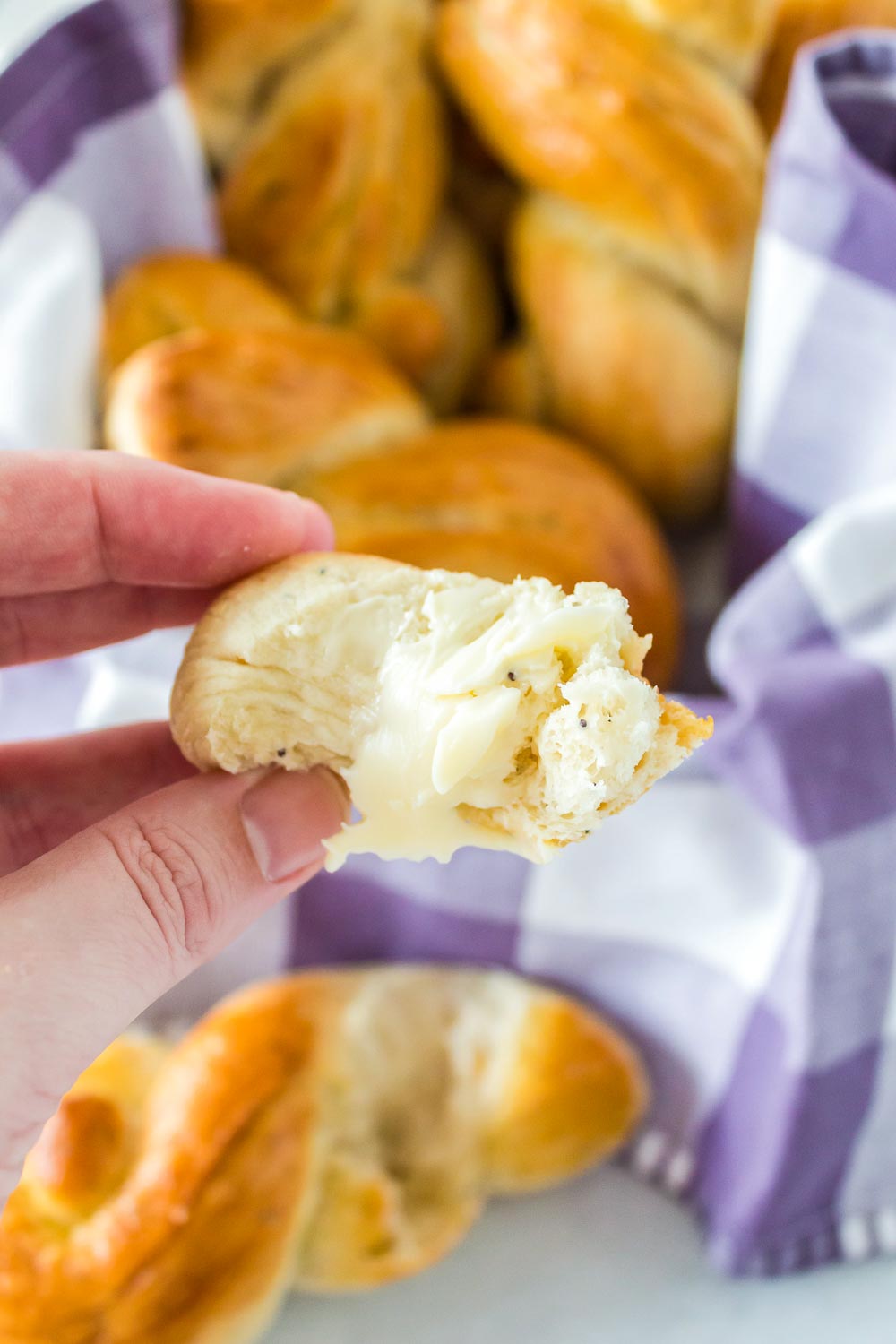 Butter spread on an Easter Dinner Roll.