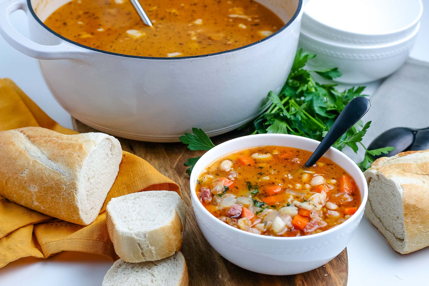 The finished Ham Bone soup in a bowl and in a soup pot.