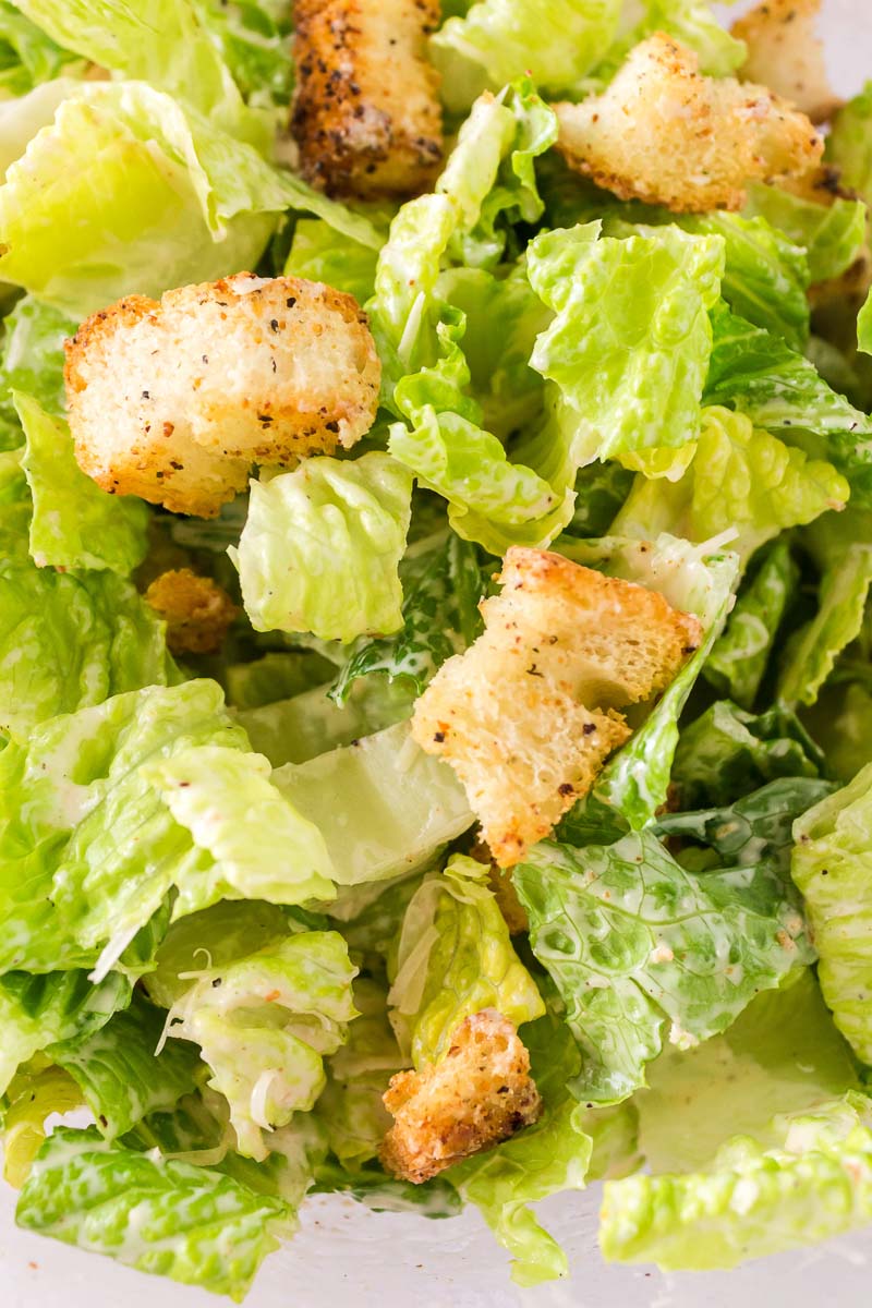 A close up overhead picture of the finished Caesar Salad. 