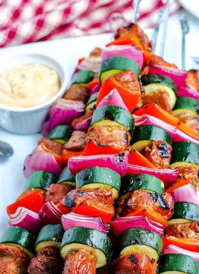 Grilled Pork Kabobs on a white serving platter.