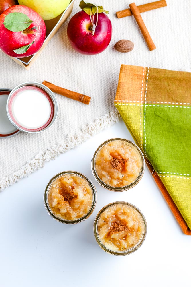 An overhead picture of homemade applesauce in canning jars.