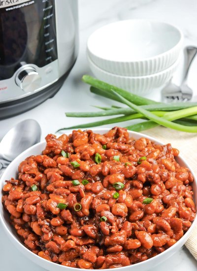 Instant Pot Baked Beans in a white serving bowl.