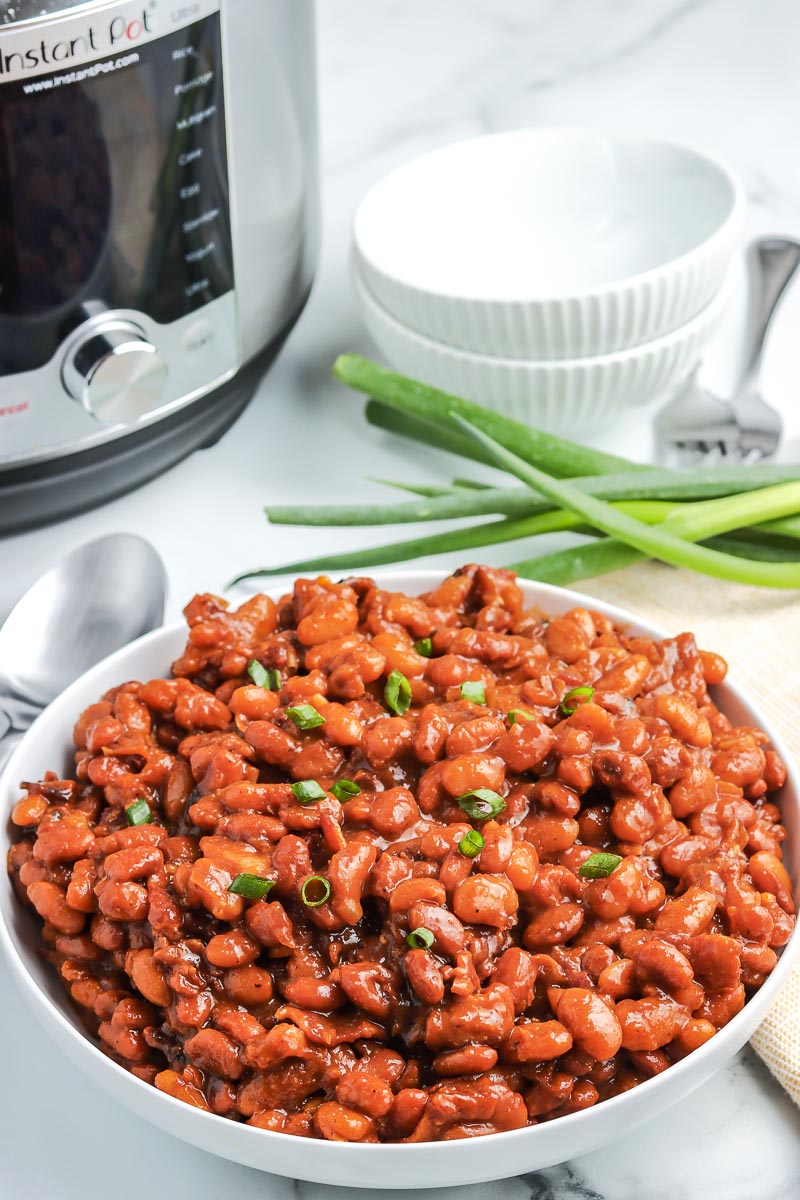 Instant Pot Baked Beans in a white serving bowl. 