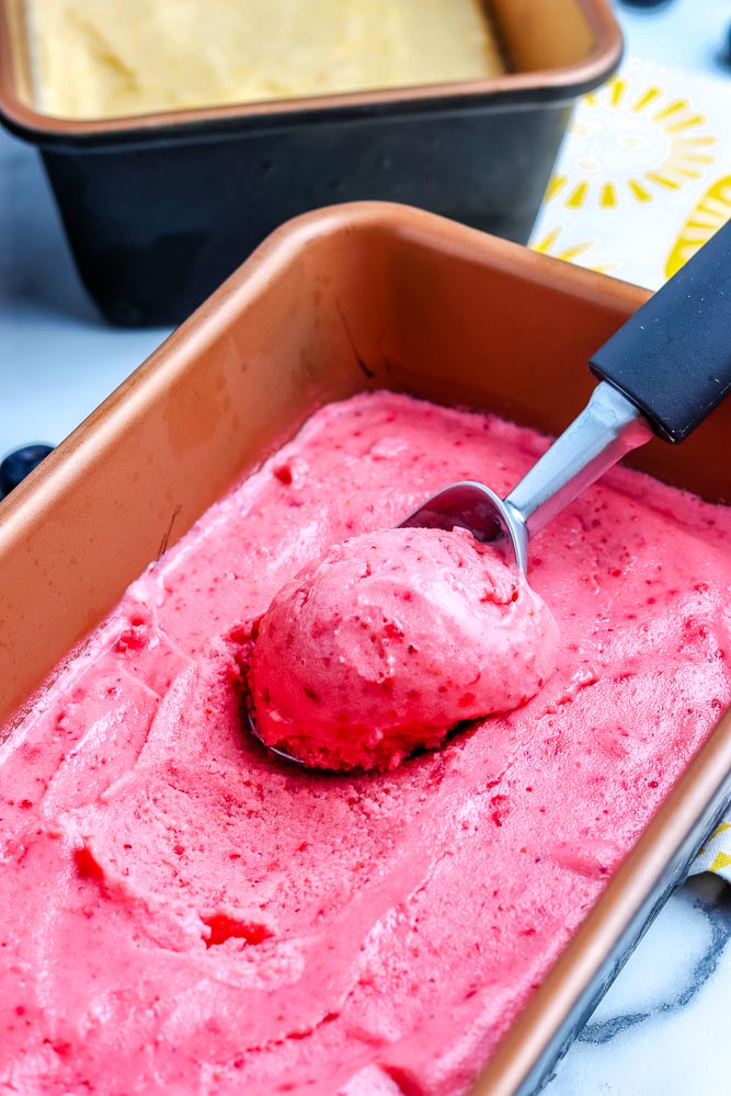 Homemade Frozen Yogurt being scooped from a container.