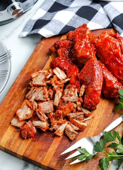 An overhead picture of the finished Instant Pot Country Style Ribs on a cutting board.