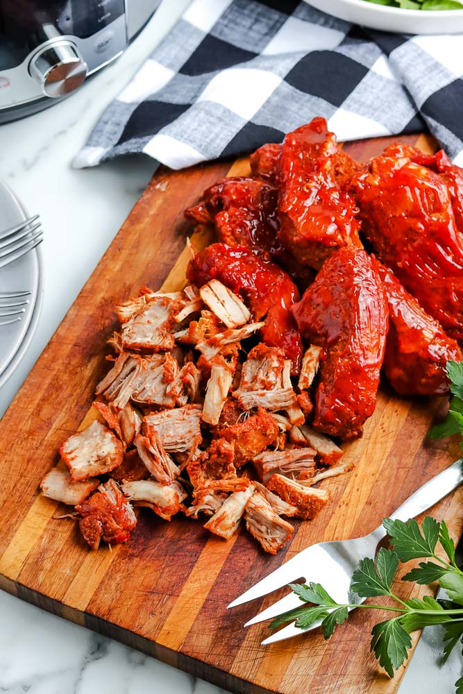An overhead picture of the finished Instant Pot Country Style Ribs on a cutting board. 