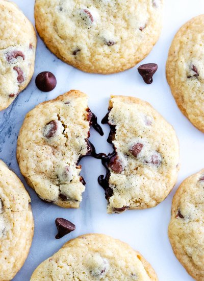 a close up picture of a Copycat Mrs. Field's Chocolate Chip Cookies broken in half.