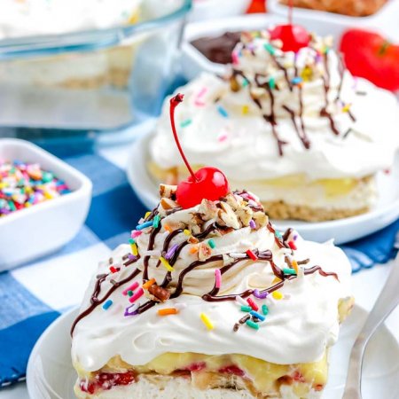 The finished No-Bake Banana Split Cake on a white plate.