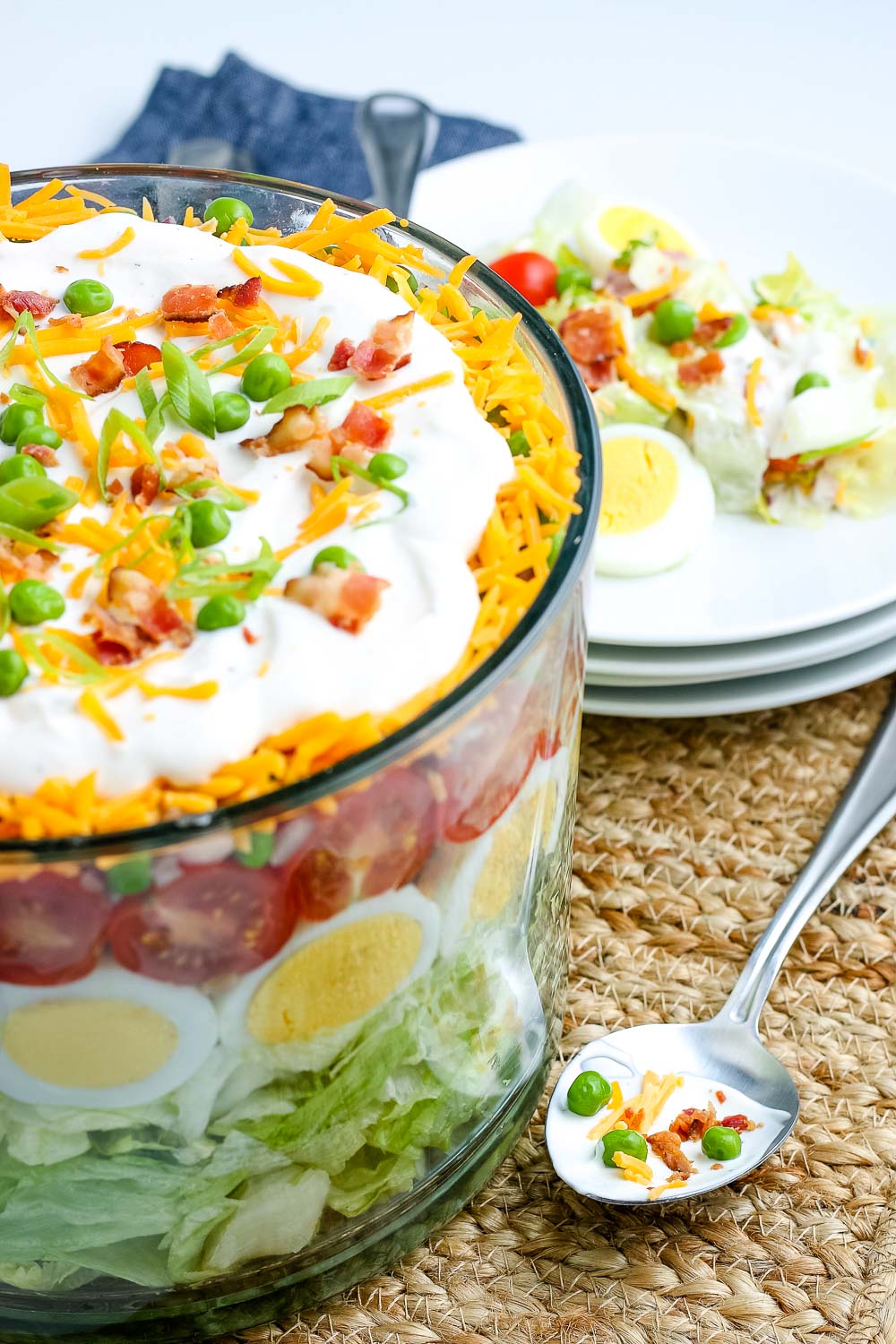 Grandma's 7 Layer Salad in a trifle dish.