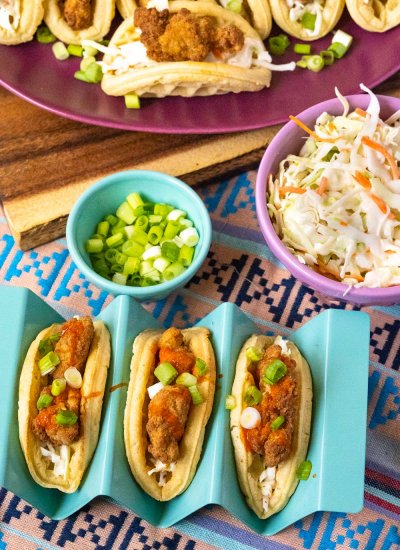 Three Chicken and Waffle Tacos on a serving plate.