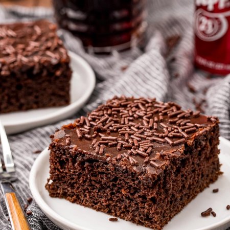 A slice of Dr Pepper Cake in the background.