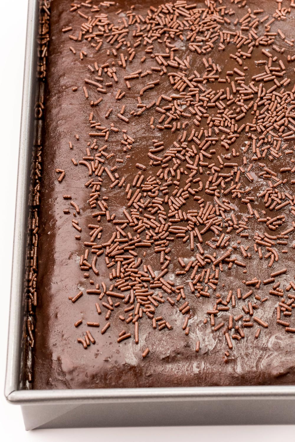 The finished Dr Pepper Sheet Cake in a cake pan.