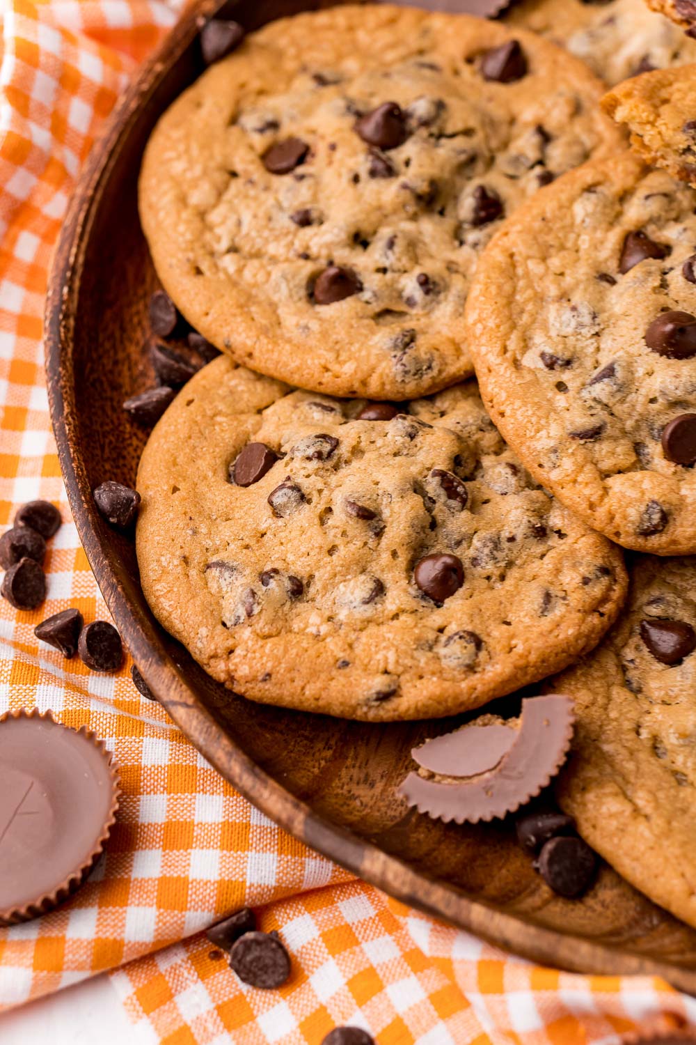 A close up picture of Reese's Stuffed Cookies on a wooden platter.