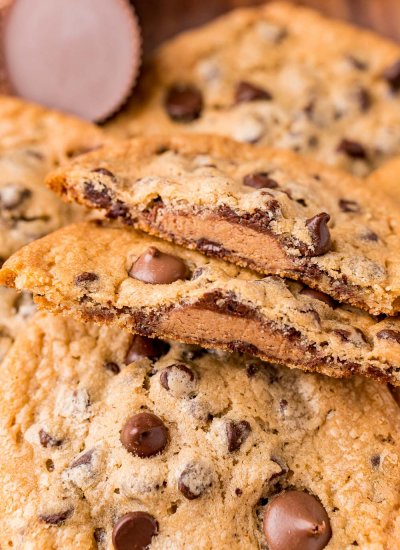 A close up picture of a Reese's Stuffed Cookie broken in half.