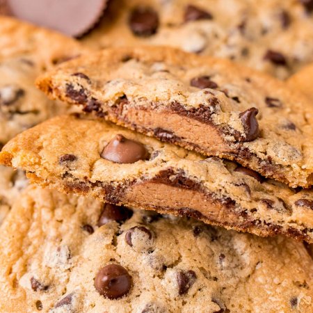 A close up picture of a Reese's Stuffed Cookie broken in half.