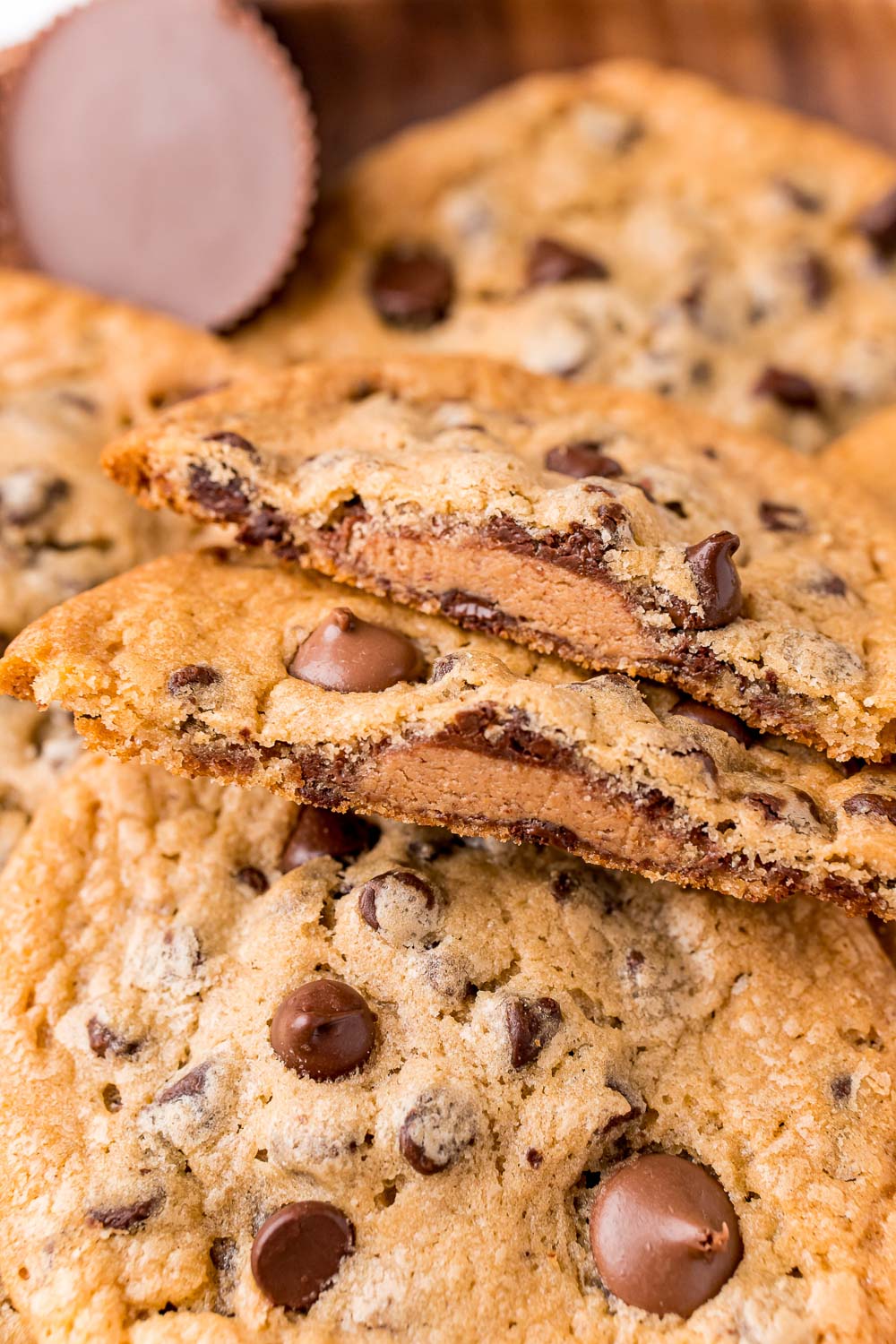 A close up picture of a Reese's Stuffed Cookie broken in half. 