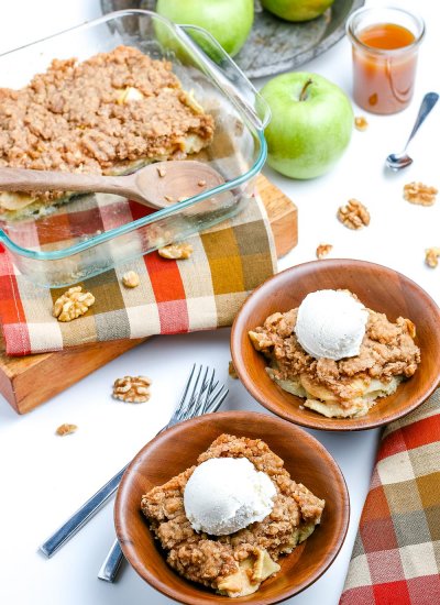 Easy Apple Crisp in a backing dish and in wooden bowls with ice cream on top.