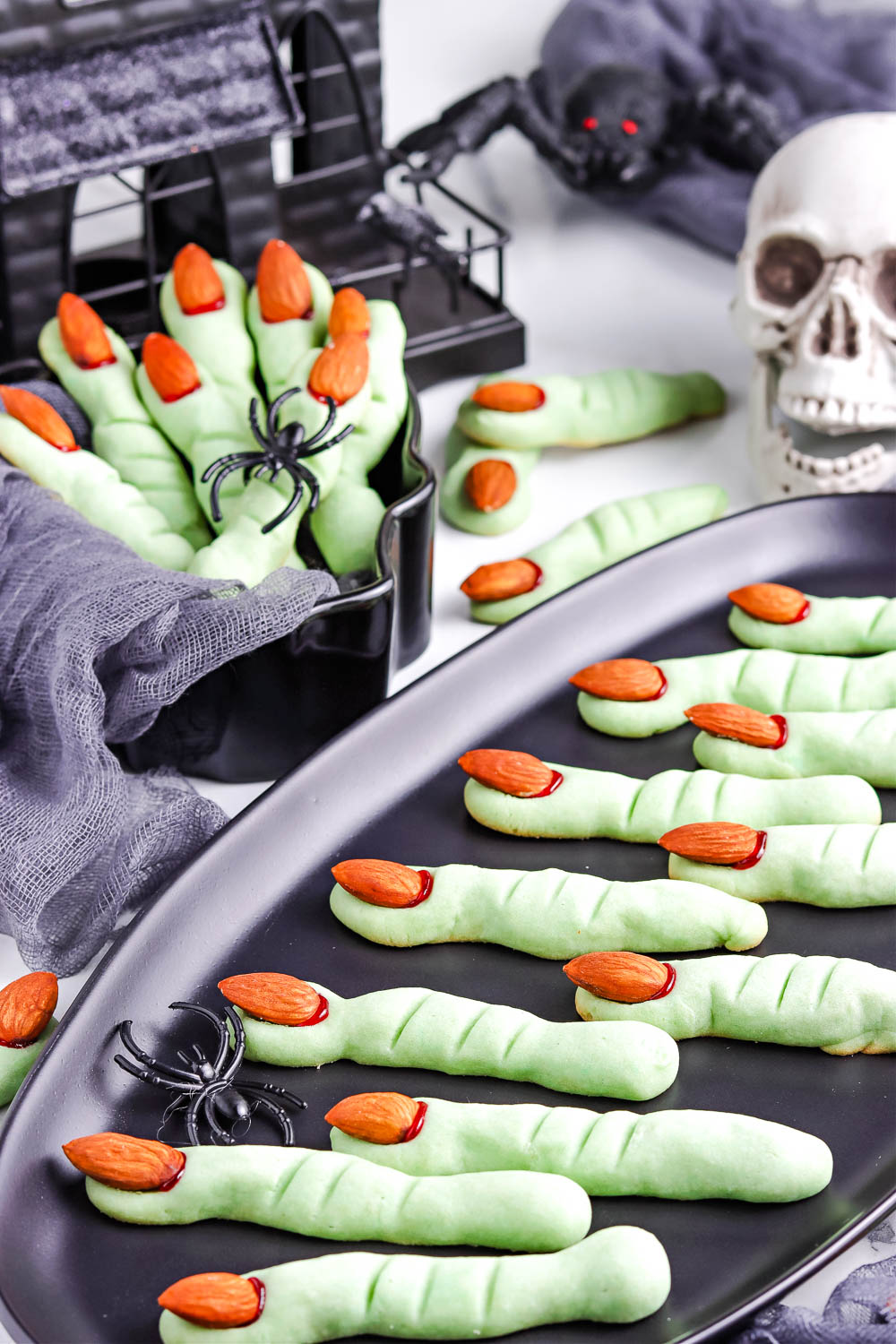 The finished Witch Finger Cookies on a black platter.